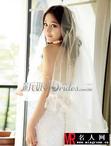张馨予白色婚纱唯美写真 低胸长裙难掩上体丰满(1)
